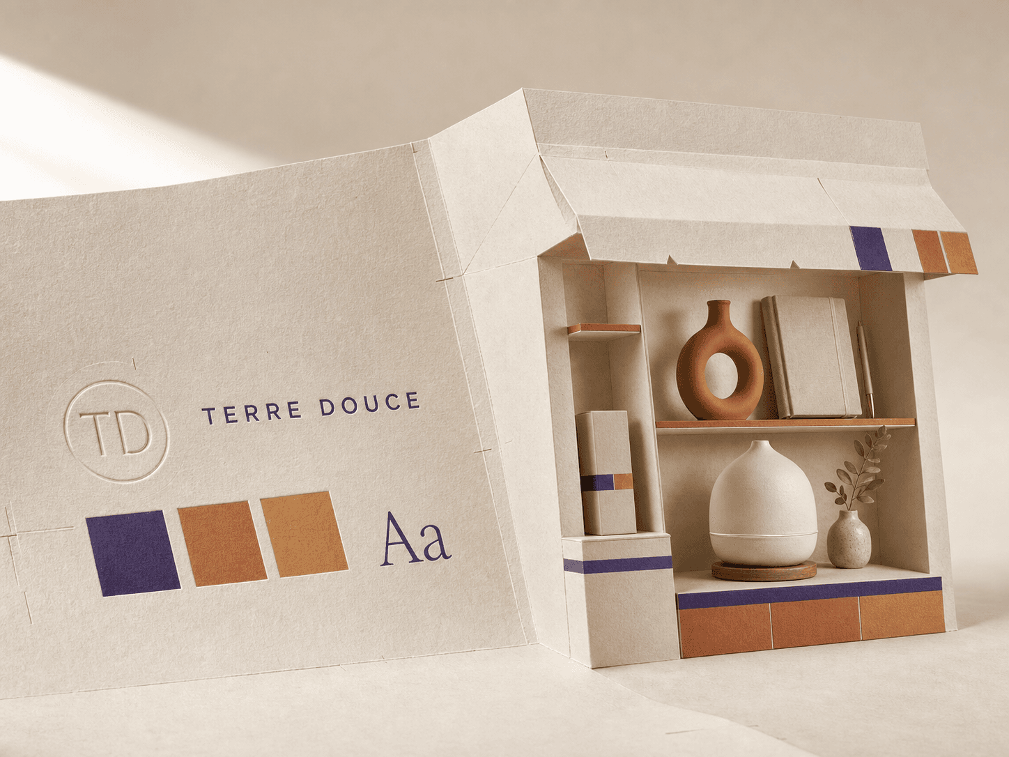 Une feuille porte le nom Terre Douce, son monogramme, sa palette et sa typographie avant de se plier en boutique prête à partager.